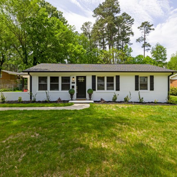 Single-story ranch home with a green front lawn, typical of West Michigan starter homes